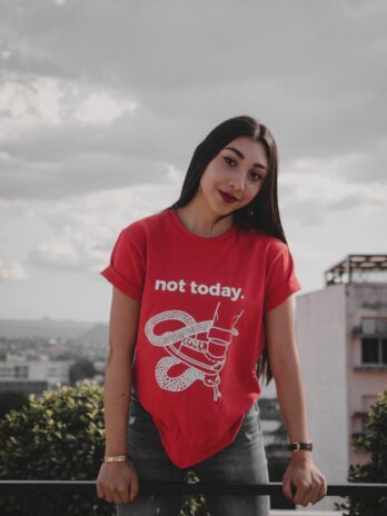 woman wearing red crew-neck with not today printed text